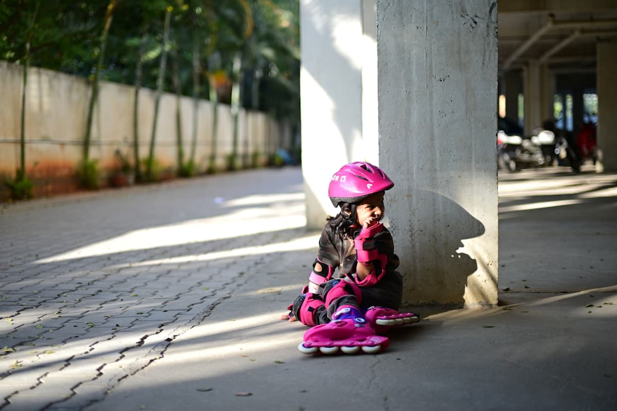 A child in protective gear, standing in for clear family safety rules